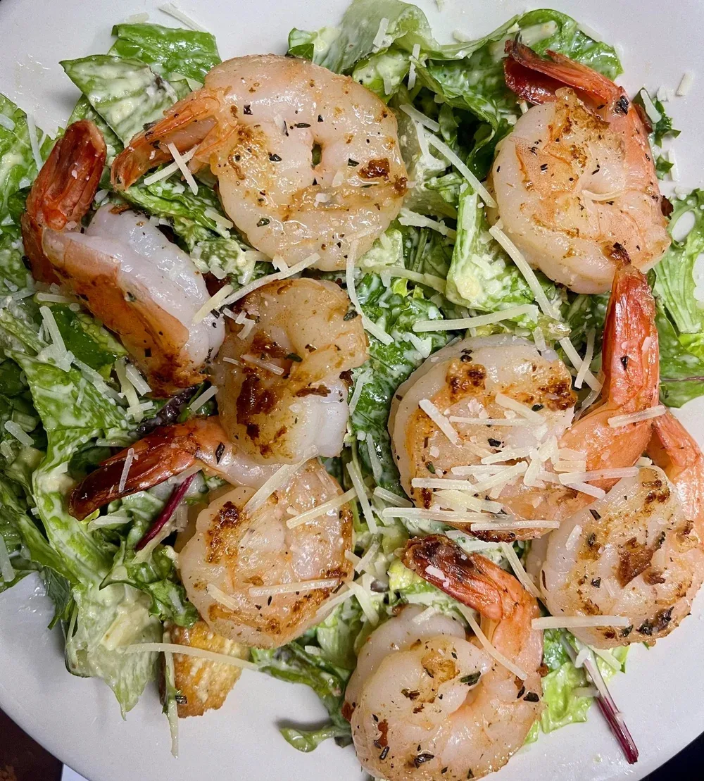 Caesar salad topped with grilled shrimp at Castle Rock in Golden Valley, AZ