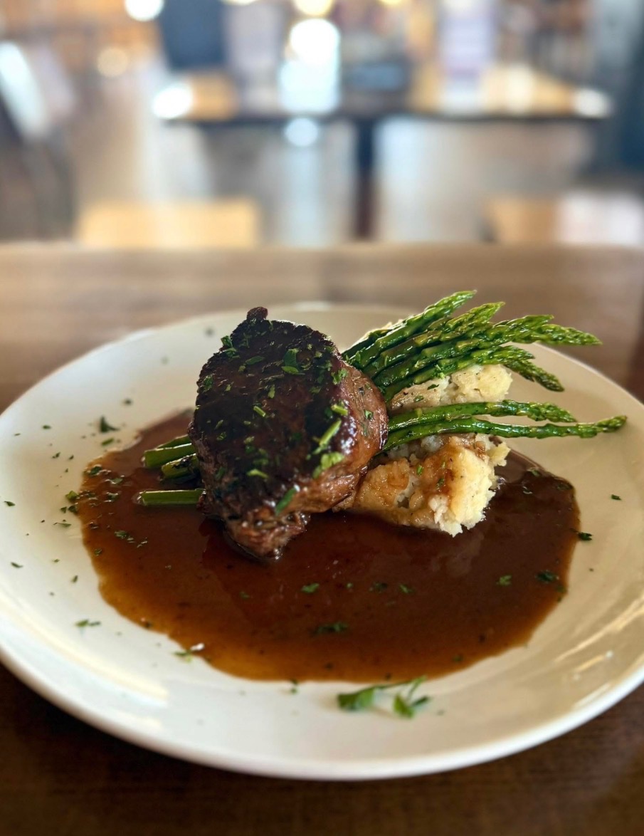 Hand-cut 6 oz filet mignon plated with sides at Castle Rock