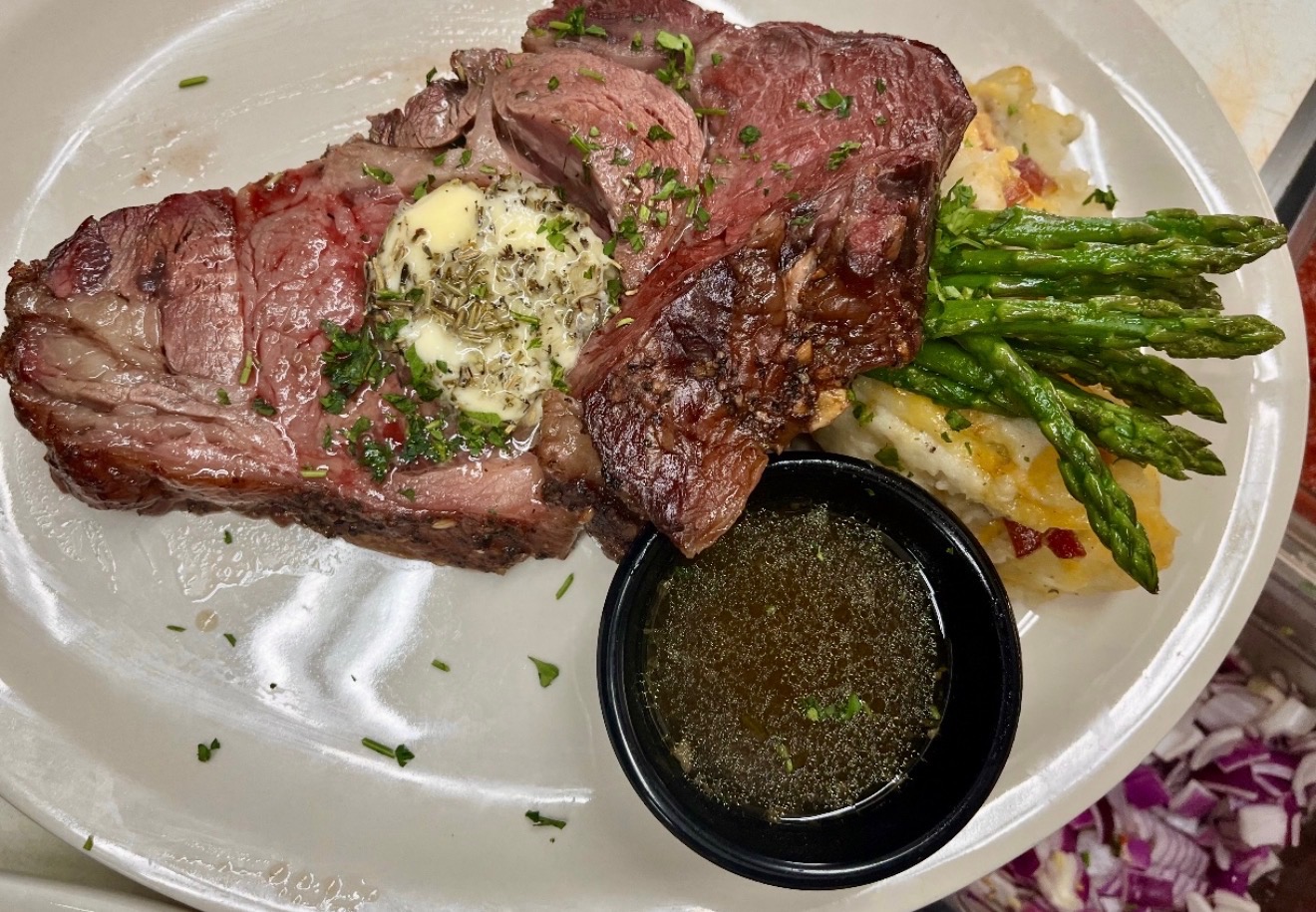 Thick hand-cut steak basted in garlic herb butter at Castle Rock